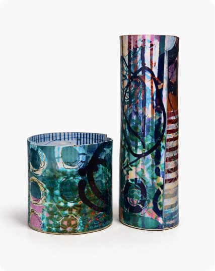 Ceramic vessels in warm red and yellow tones